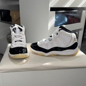 Jordan Kids Black and White Sneakers with Gold Accents